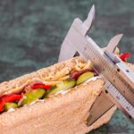 a vernier caliper measuring a sandwich