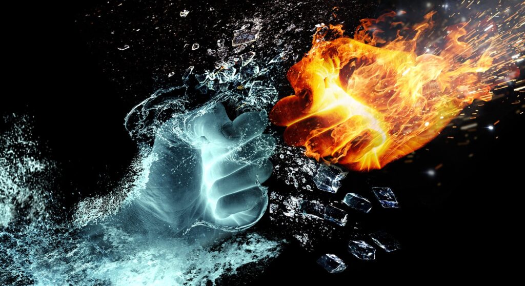 two hands colliding one is water and the other is fire