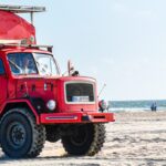 Red truck on the beach