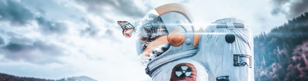a person in a radioactive protection suit and a butterfly in the mask viewer