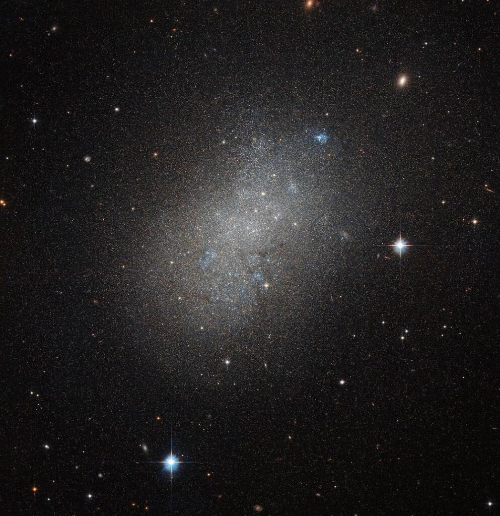 Irregular galaxies have unusual shapes, like toothpicks, rings, or even little groupings of stars. They range from dwarf irregular galaxies with 100 million times the Sun’s mass to large ones weighing 10 billion solar masses.
