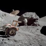 AS17-146-22294 (13 Dec. 1972) --- Scientist-astronaut Harrison H. Schmitt is photographed working beside a huge boulder at Station 6 (base of North Massif) during the third Apollo 17 extravehicular activity (EVA) at the Taurus-Littrow landing site. The front portion of the Lunar Roving Vehicle (LRV) is visible on the left. This picture was taken by astronaut Eugene A. Cernan, Apollo 17 commander. Schmitt is the lunar module pilot. While astronauts Cernan and Schmitt descended in the Lunar Module (LM) "Challenger" to explore the moon, astronaut Ronald E. Evans, command module pilot, remained with the Apollo 17 Command and Service Modules (CSM) in lunar orbit.