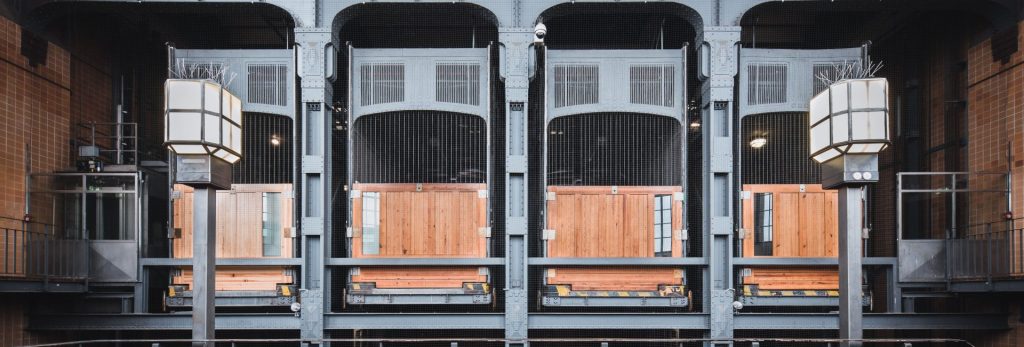 Interior view of the historic Old Elbe Tunnel elevators in Hamburg, showcasing architectural details.